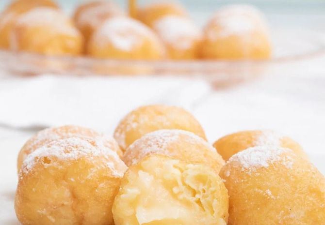 Los escaparates de las pastelerías madrileñas se llenan estos días de buñuelos de viento, que se alzan como los grandes protagonistas del Día de Todos los Santos.